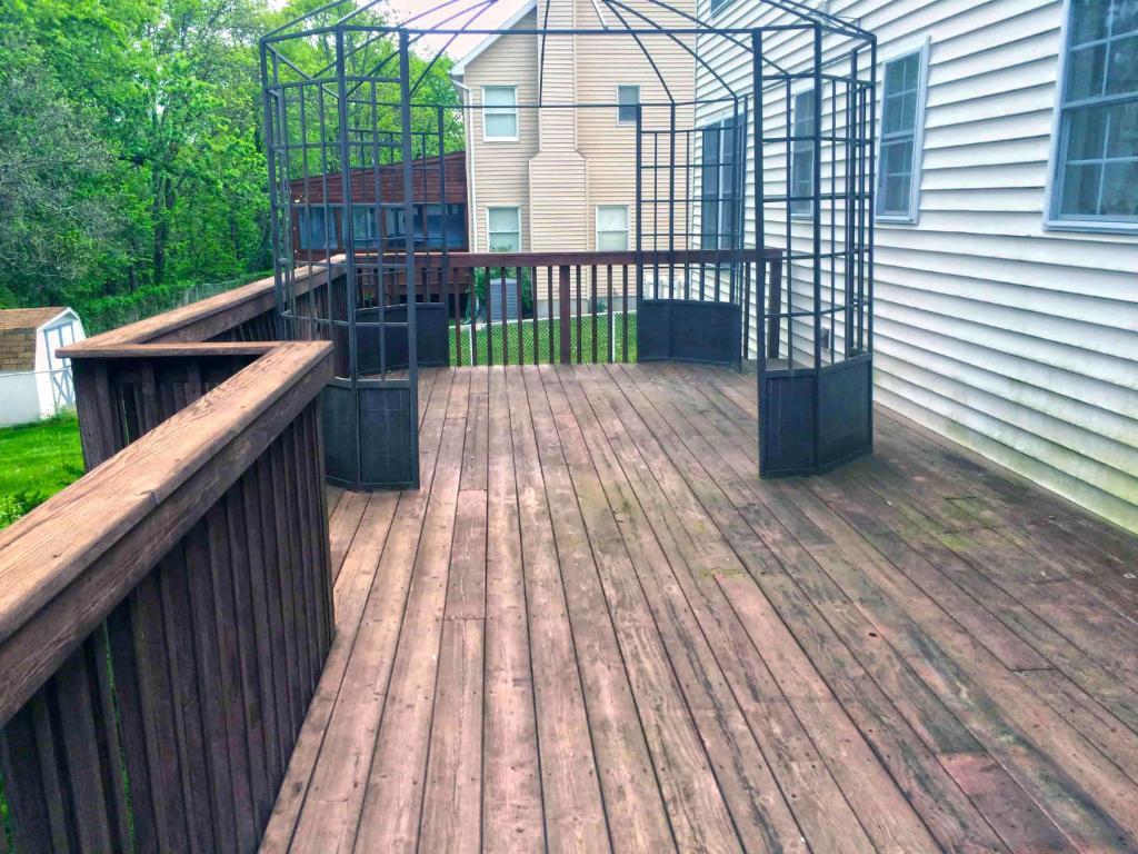 71401-before-power-washing-decking-far-back