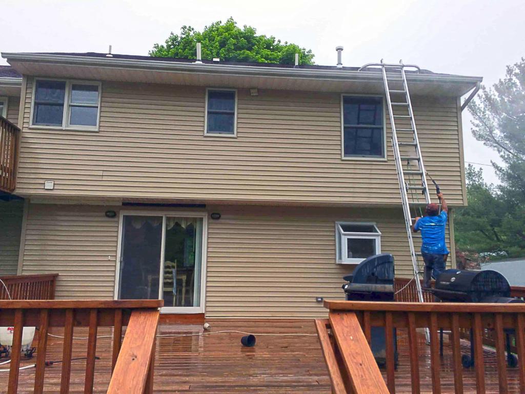 73105-during-power-washing-back-side-home