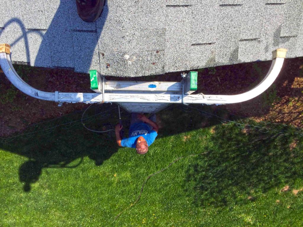 73501-employee-climbing-ladder-roof