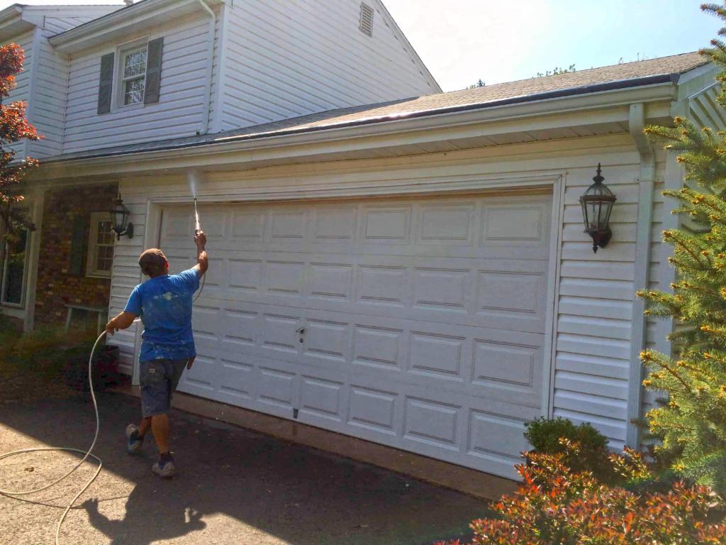 73502-employee-power-washing-garage-door
