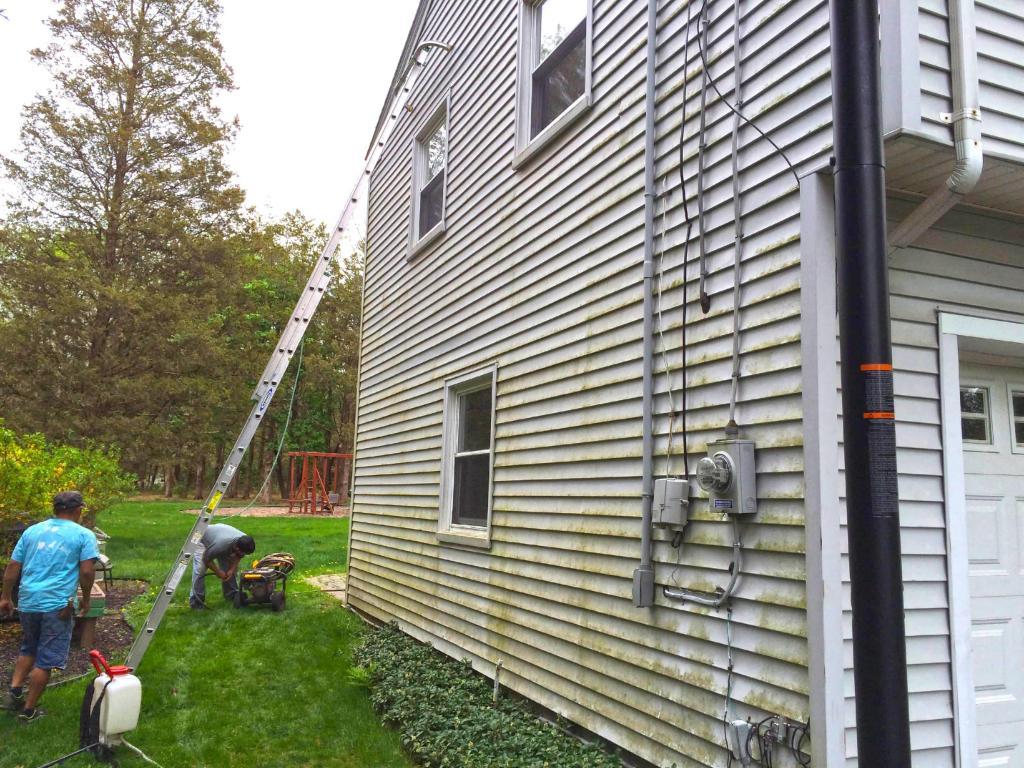74501-before-power-washing-left-side-home