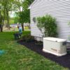 74511-employee-adding-black-mulch-right-side-house