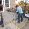 75805-employee-painting-deck-waterproof-solid-stain